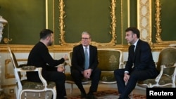 Ukraine's President Volodymyr Zelenskyy, Britain's Prime Minister Keir Starmer and France's President Emmanuel Macron hold a meeting during a summit at Lancaster House in central London, March 2, 2025. 